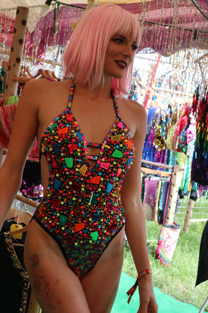 customer wearing neon jewel bodysuit